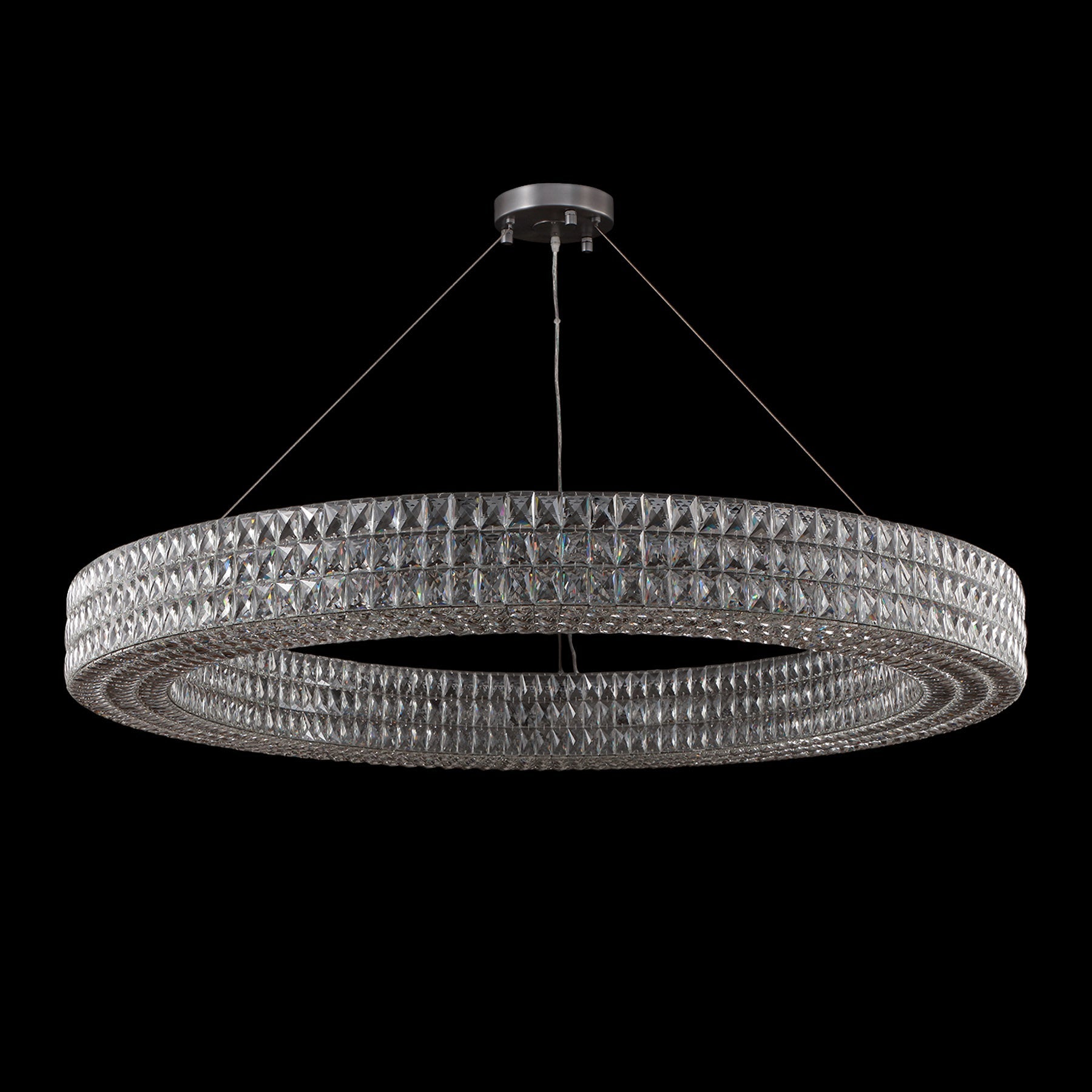 Chandelier with multiple rings on a black background