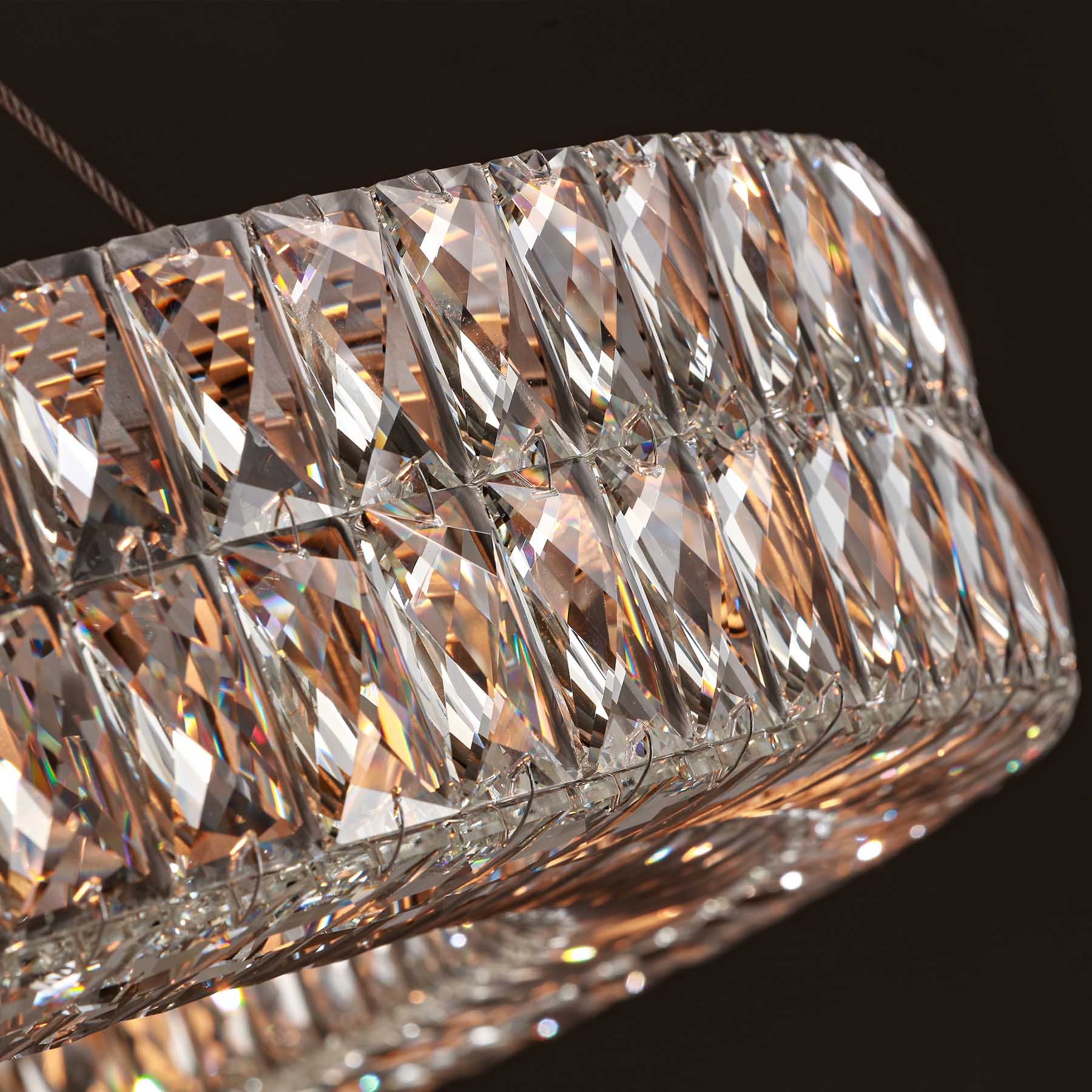 Close-up of a crystal chandelier with a dark background