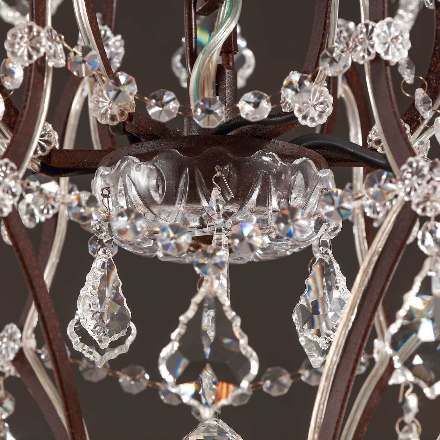 Close-up of a chandelier with crystal elements on a dark background