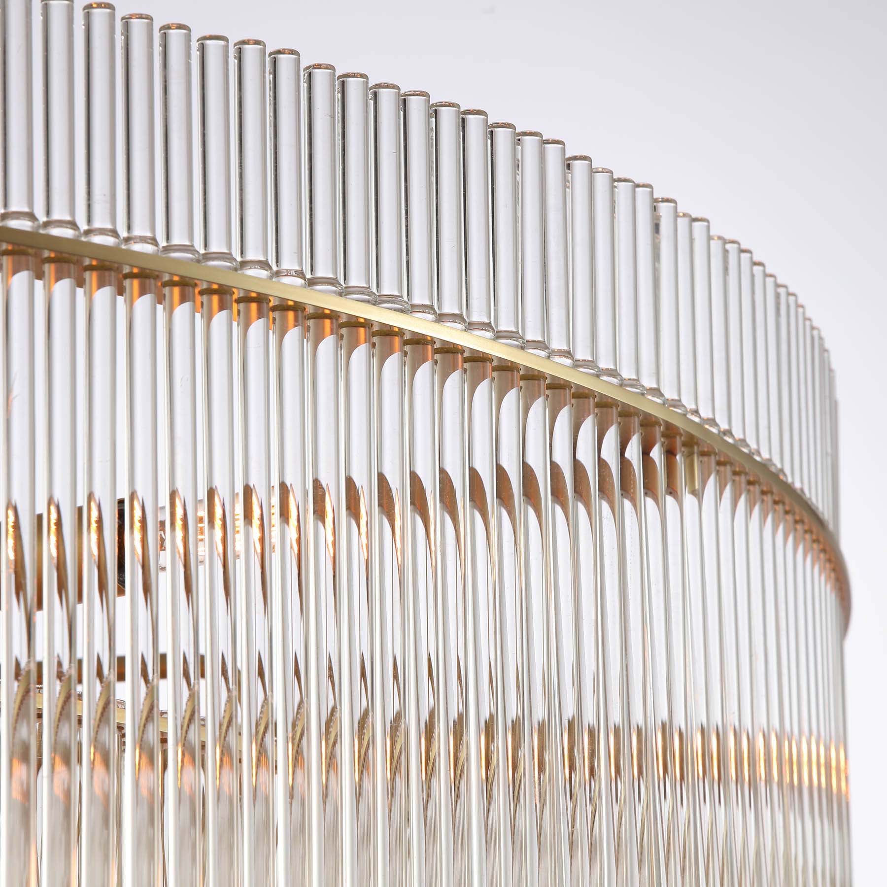 Close-up of a modern chandelier with cylindrical glass elements.