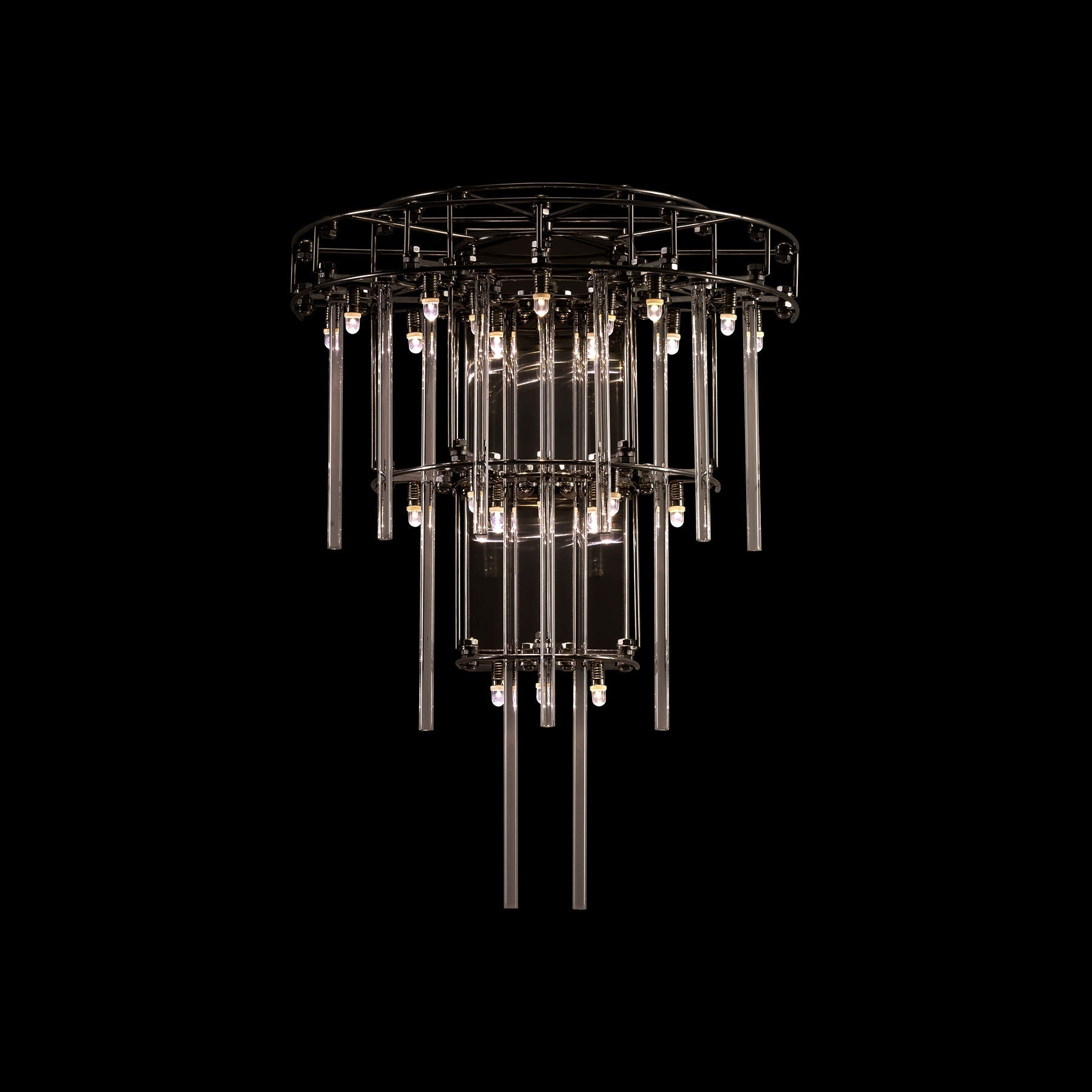 Chandelier with multiple tiers of lights on a black background