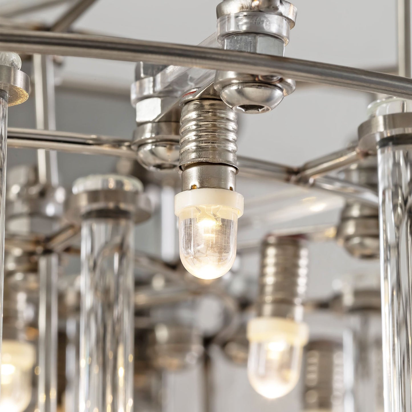 Close-up of a chandelier with metallic and glass design.